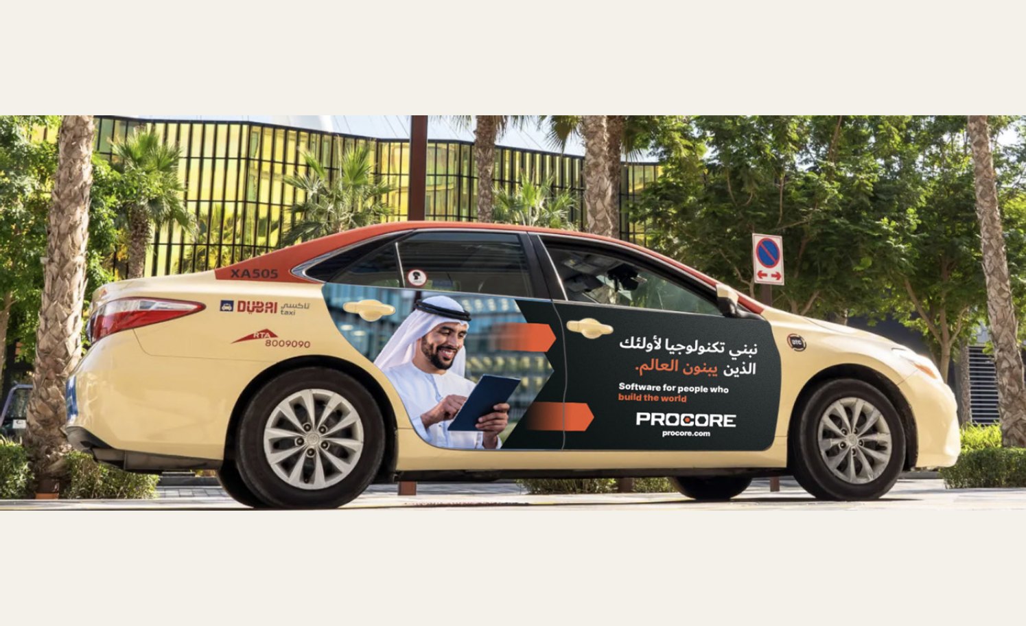 Procore campaign wrap on a Dubai taxi with Arabic and English headlines reading 'Software for people who build the world'.